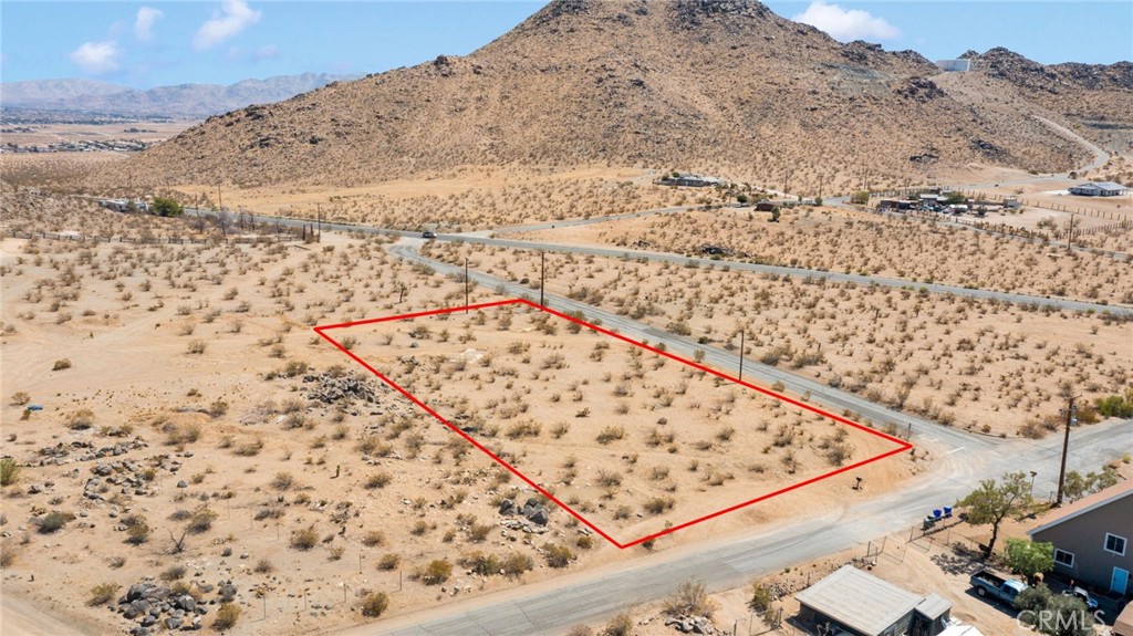 Here is an exceptional opportunity in Apple Valley: a corner parcel just over one acre with sweeping views and abundant room to create your dream home. In a neighborhood poised for growth, this lot offers generous space to plan and design; whether a custom build, perfectly positioned to soak in sunrise or sunset, paired with outdoor living areas that flow naturally into the desert surroundings. Its corner location enhances access and orientation, affording flexible layout options. The views alone are magical, inspiring peace and possibility at every moment. With so much room to grow, this property can be whatever you want it to be—your forever home, an investment, or your private retreat. If you’ve been looking for land that combines potential and beauty, this corner acre in Apple Valley hits every mark.