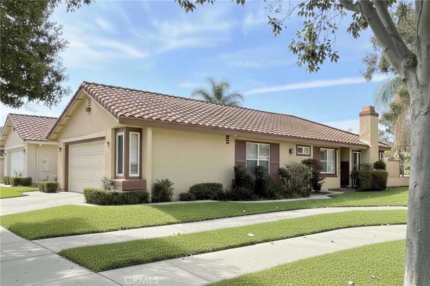 Serene Gated Community of Mountain Meadows.  This is a Wonderful Single Story Home featuring 1,626 sqft interior space on a 5,100 sqft lot with 2 bedrooms plus an office and 2 full bathrooms! Inviting front door area with greenbelt, walking path and double door entry leads you to the open living room with vaulted ceilings, gas fireplace and sliding doors to the serene back yard. Adjacent to the living room is the dining room and slider to a peaceful atrium. Spacious, updated kitchen with granite counters, glass tile backsplash, breakfast bar, wine fridge, pantry with pull out shelves and windows with peaceful view of the back yard. Large master suite with vaulted & insulated ceilings, ceiling fan, slider to the second atrium patio, sky light, two closets, huge walk-in tile shower, large Jacuzzi tub, two sinks with vanity area in the middle. Secondary bedroom with mirrored closet doors. Other features throughout the home include real hardwood floors, shutters, ceiling fans and updated lighting. 2-car attached garage with with EV Charger, storage cabinets and laundry. This gated community lush green belt areas, walking paths and located close to restaurants, shops, freeway, Fairplex, Mountain Meadows Golf Course and Bonelli Park. Available to move-in from 11/01/25.