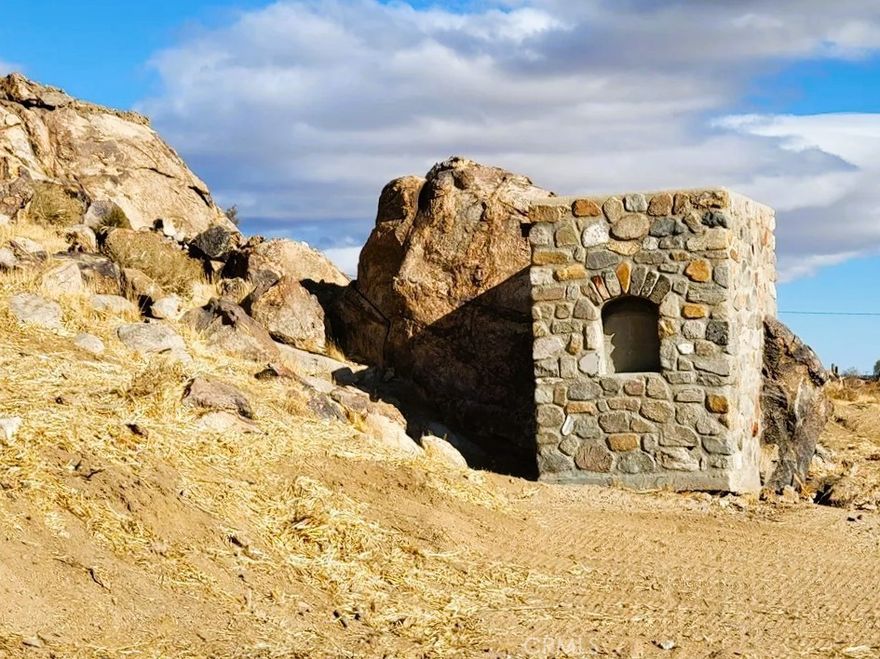 Check Out this 3.3-Acre Property with MAIN ROAD Frontage at 30588 CA-18, Lucerne Valley! Located on the WEST Side of Town with Outstanding HIGHWAY Exposure, this Unique Lot Boasts a Rocky Butte/MOUNTAIN to Explore, INCLUDING A SMALL ROCK ROOM Carved into the Rock — Perfect For Storage, Shelter or Just Exploring! A Large Concrete DRIVEWAY is Already IMPROVED on the Site. With ELECTRICITY and NATURAL GAS Likely Easy to Connect (a House Was Previously On-Site — Buyer to Verify), the Utilities Are Very Favorably Positioned. Zoned LV/RL, VIEWS of the Desert & Mountains. This Property is Full of POTENTIAL — Don’t Miss the Chance to See It in Person!