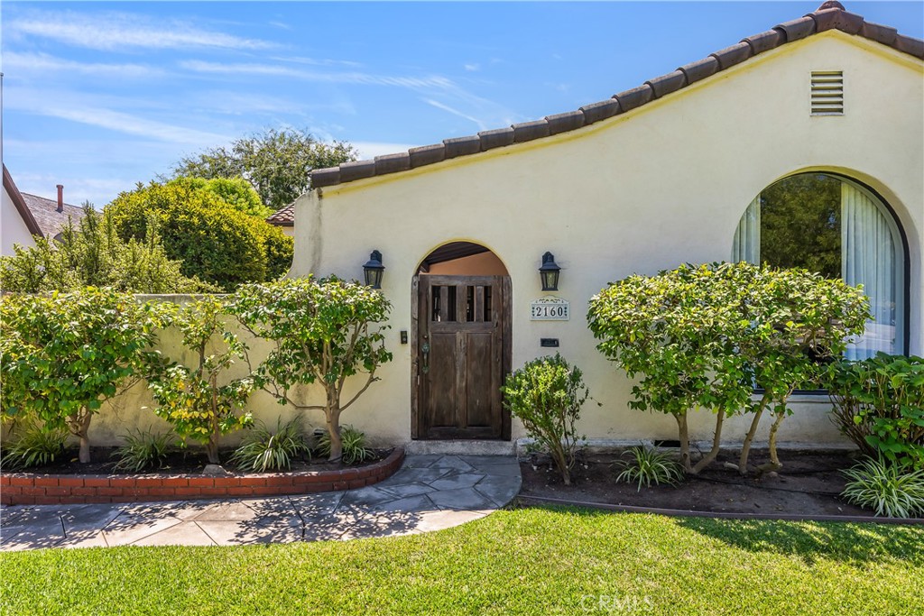 welcome to this beautifully restored 1930s Spanish bungalow!
Step into a private courtyard—perfect for enjoying a glass of wine at sunset while taking in the serene mountain views.
Inside, the light-filled, open floor plan showcases timeless charm with arched doorways, beautiful built-ins .hardwood floors, and high ceilings throughout. French doors open from both the living and dining rooms, seamlessly blending indoor and outdoor living.
True to its era, the home includes a California basement—reimagined as a stylish speakeasy, complete with a bar, wine fridge, and a cozy pub table for cigars or card games.
The home features three generously sized bedrooms, each with ample closet space. The spacious primary suite offers a walk-in closet, a luxurious ensuite bath with a double vanity, walk-in shower, and custom vintage-style tilework that pays homage to the home's heritage. Step out onto the private deck from the primary suite to enjoy your morning coffee overlooking the lush backyard and sparkling pool and spa and mature landscaping.
A detached garage includes additional storage and offers great potential for an ADU conversion.
This is a rare opportunity to own a piece of California history with all the modern comforts!
