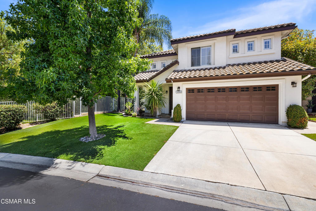Tucked behind the gates of Verdigris in Lang Ranch, this beautifully updated home offers incredible views and a peaceful setting with only one direct neighbor. Backing to open canyon space, the property feels private and serene, with a spacious side yard and panoramic mountain views.Inside, the open layout is filled with natural light and features hard surface flooring throughout. The kitchen has been tastefully remodeled with crisp white cabinetry, quartz counters, and stainless steel appliances. All secondary bedrooms are generously sized, and the oversized fifth bedroom is equipped with theater equipment--perfect for movie nights, gaming, or entertaining.The primary suite overlooks the beautiful open space and hillside views. The en suite bath offers a luxurious retreat with travertine stone finishes, a separate shower and soaking tub, and a walk-in closet complete with built-in storage.Bathrooms throughout the home have been thoughtfully upgraded, and additional features include crown molding, plantation shutters, fresh contemporary paint, and a low-maintenance yard with turf and travertine hardscape.Verdigris is a sought-after gated community offering fantastic amenities like a pool and spa, tennis courts, and a shaded outdoor lounge area. Zoned for award-winning Lang Ranch Elementary, Los Cerritos Middle, and Westlake High. This is a rare opportunity to own a view home in one of the most desirable pockets of Lang Ranch.