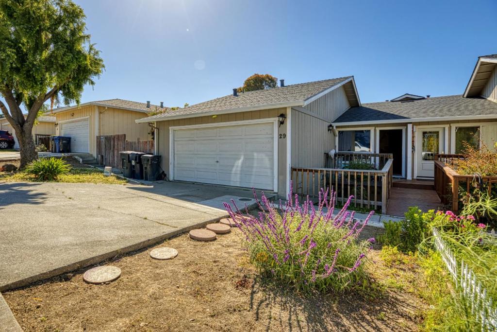 Welcome to this charming 3-bedroom, 2-bathroom home located in a great location close to shopping walking trails of the wet lands area and easy freeway access. At 1,166 sq ft, this residence offers a functional layout perfect for comfortable living. Laundry chores are made easy with single level living and an in-garage setup, providing practicality and convenience. Additional amenities include a 2-car garage and central forced air gas heating to keep you comfortable year-round. The mild climate of Watsonville is comfortable living. Although the backyard slopes below the main level it is a sizeable yard with sizeable space for your imagination.