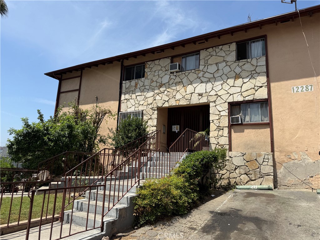 Welcome to this beautifully maintained 3-bedroom, 2-bathroom condo offering 1,134 SqFt of comfortable living space, nestled in a quiet neighborhood of Pacoima. Freshly painted throughout, this home features an inviting open kitchen that flows seamlessly into the dining and living areas—perfect for relaxing or entertaining. Located directly across the street from the scenic Hansen Dam Golf Course, you’ll enjoy beautiful green views and access to open outdoor space, including hiking and biking just steps from your front door. The neighborhood also offers a variety of local restaurants and eateries within walking distance, adding convenience and flavor to your everyday life. Whether you're a first-time buyer, looking to downsize, or seeking a smart investment, this condo combines comfort, location, and lifestyle. Don’t miss the chance to make this your new home!