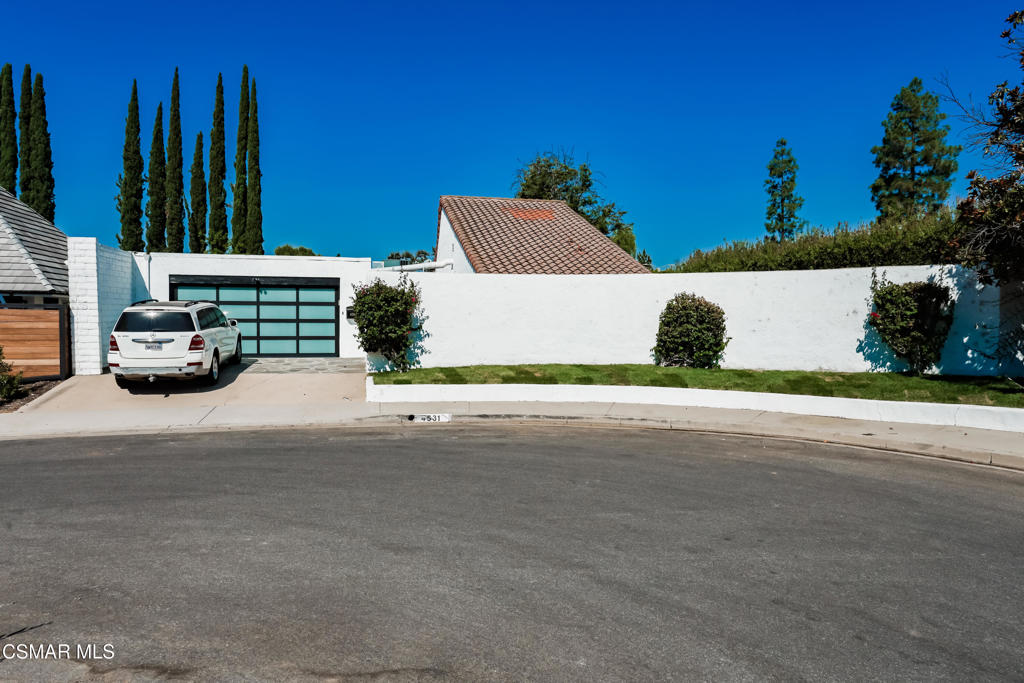This stunningly renovated modern residence in Westlake Village's First Neighborhood showcases soaring vaulted ceilings in the great room, embodying the desirable open concept design. Elegant wood plank flooring flows seamlessly through the main living spaces, while the kitchen features luminous granite countertops, white cabinetry, and high-end stainless steel appliances, including double ovens, ideal for those who love to cook. The owner's suite is thoughtfully positioned away from the other bedrooms, ensuring privacy, and the luxurious bathroom is adorned with beautiful marble flooring, a frameless shower door, and dual sinks. Down the hallway, three additional bedrooms share a full bathroom, complemented by a convenient powder room near the great room. Expansive sliding glass doors open to a delightful backyard and a flagstone-paved interior courtyard, all set on a generous 9,000+ square foot lot that enhances the outdoor living experience. This exceptional oversized lot is a rarity in the neighborhood, providing a wonderful outdoor environment. The two-car garage includes laundry facilities and direct access to the interior courtyard, while the community pool and common area are just moments away. Short-term rentals is possible.