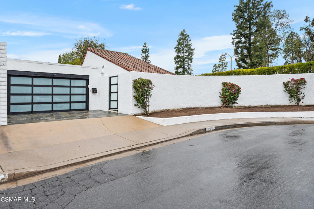 This beautifully remodeled modern home in Westlake Village's First Neighborhood features impressive vaulted ceilings in the great room, creating the sought-after open concept layout. Elegant wood plank flooring extends throughout the main living areas, while the kitchen boasts bright granite countertops, white cabinetry, and stainless steel appliances, including stainless steel appliances and double ovens, perfect for culinary enthusiasts. The owner's suite is strategically located away from the other bedrooms for added privacy, and the bathroom showcases exquisite marble flooring, a frameless shower door, and double sinks. Three additional bedrooms are situated down the hallway, sharing a full bathroom, with a convenient powder room adjacent to the great room. Abundant sliding glass doors lead to a charming backyard and a flagstone-paved interior courtyard, with ample space on the expansive 9,000+ square foot lot. This rare oversized private lot for the neighborhood adds a wonderful outdoor environment. The two-car garage includes laundry facilities and direct access to the interior courtyard. The community pool & common area is seconds from the home. SHORT-TERM is possible.
