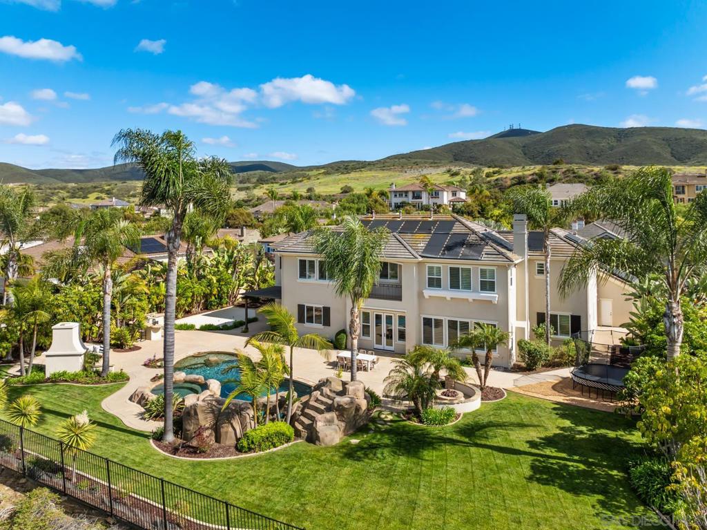 Located on a private cul-de-sac in the gated community of Ivy Gate, this spectacular 5-bd, 5.5-ba home offers luxury living at its finest. Perched on a view lot, the entire interior & exterior have been freshly repainted. Spacious floor plan incl a 1st fl guest suite, 2 bonus rooms ideal for office, gym, or playroom. The chef’s kitchen overlooks a resort-style backyard featuring a pool/spa, built-in BBQ, multiple outdoor gathering areas & even space for a pickleball court. Perfect for entertaining or relaxing! Solar, low HOA, PUSD. Situated on a view lot just under 1/2 acre, this home has been beautifully maintained and recent updates include new paint on interior and exterior, all new lighting & new faux rock detailing around pool. A grand entry welcomes you with dual staircases and soaring ceilings. The first floor features a private guest suite in a separate wing, two bonus rooms, and a chef’s kitchen that opens to a spacious family room with a back staircase. Generous formal living and dining areas offer ample space for entertaining. Upstairs boasts a loft ideal for kids, plus three secondary bedrooms—each with ensuite bath and walk-in closet. The expansive primary suite offers a private sitting area, large walk-in closet, & balcony w/views. Perfect for entertaining or relaxing, this home combines elegance, function, & resort-style amenities in one incredible package. Located in PUSD, close to schools, shopping, hiking trails and freeways!