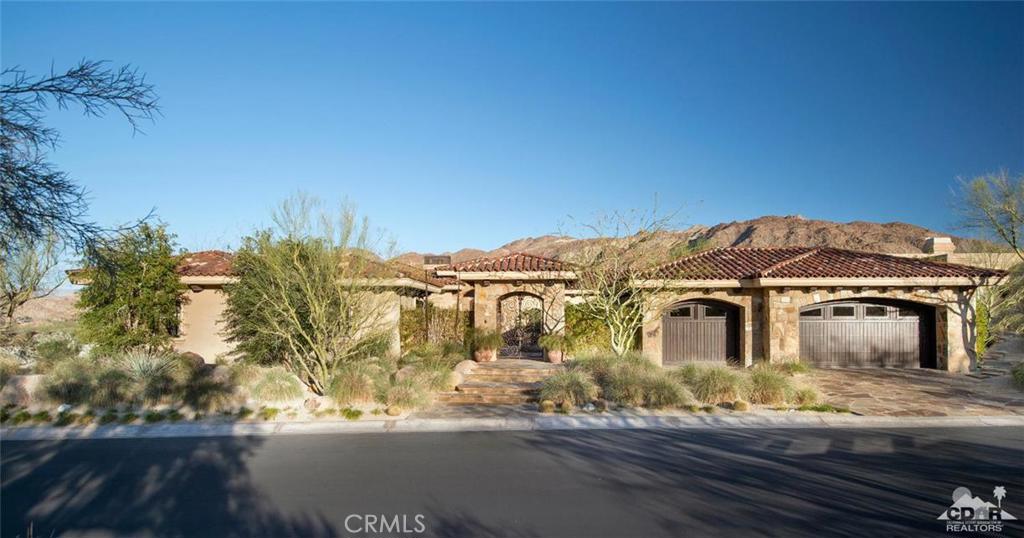 Auction: March 29, 2016. Previously listed at over $6 million. Selling without reserve to the highest bidder. 3 ensuite bedrooms & office in main house with 2 room guest house, 6434 sq.ft. The modern yet warm interiors effortlessly complement the inspiring mountain views, this contemporary Tuscan style sanctuary is a complete rejuvenation for the senses & the soul, all within the confines of The Reserve Club, one of Luxury Golf & Travel Magazine's Top 25 private golf communities in America. The Reserve offers unparalleled privacy and natural serenity, along with premier amenities,an 18 hole world class golf course designed by Tom Weiskopf and Jay Morrish, 3 practice holes, tennis, spa and fitness center, and fine dining options. Impeccable design indoors and out, along with the amenities of a 5-star resort this is the ultimate desert oasis retreat, just 10 minutes away from El Paseo the Rodeo Drive of the desert. Open daily 1-4, must call for gate entry.