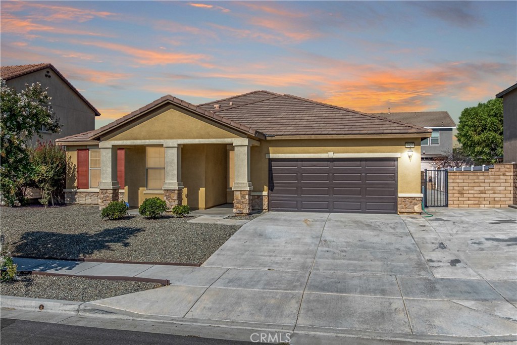 LOCATION...SINGLE STORY...GREAT COMMUNITY. The front porch welcomes you into this charming 4 bedroom, 2.5 bathroom single story home with 2,200 square feet. Nestled within the desirable Everton Grove subdivision, these homes were originally built by Pulte Homes. Featuring an open concept floorplan with high ceilings, recessed lighting, and wide hallways, this home offers a comfortable layout that is perfect for everyday living and entertaining. The entire interior of the home was just painted with a gorgeous neutral color scheme with brand new baseboards. The entire home also has brand new luxury vinyl planks throughout the entire home (no carpet). Further, you'll find a huge light-filled great room, a separate dining area, and a gourmet kitchen with an island, new stainless-steel appliances, new kitchen faucet, walk-in pantry, and plenty of cabinet space. Near the spacious walk-in pantry, there is a utility closet and small butler's pantry, perfectly sized for your custom coffee bar. Convenient direct kitchen access from your attached 2-car garage. Down the hall, you will find a private inside laundry room with sink. The primary bedroom is good sized, and includes a walk-in closet, private en-suite bathroom with dual sink vanity with stone counters, new toilet, walk-in shower, and a separate soaking tub. The primary bedroom is private and separate from the 3 additional bedrooms - 2 of the secondary bedrooms have walk-in closets. There is a second full bath in the hallway of the secondary bedrooms with stone counters, new toilet, and the vanity and toilet/showering rooms are in separate areas. What is unique about this floorplan is there is also a half bath away from all the bedrooms and perfect for your guests. The French door in the dining room leads outside to the California room with a built-in covered patio area. This home also features an extended large driveway to park 4+ vehicles, and a large side yard with possible RV/boat parking. Both the front and backyards are low maintenance and designed to conserve water. The front and back fences are block walls, and the side fences in between the houses are vinyl. Conveniently located near great schools, parks, shopping, and major highways, this hard-to-find single story is a great opportunity to own in an amazing neighborhood. BONUS - there is no HOA dues in this community - but there are lots of community parks and activities to take advantage of. Welcome home!
