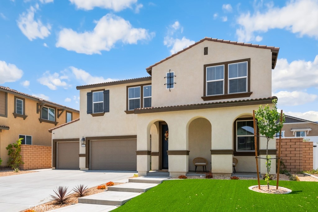 PAID-IN-FULL SOLAR! This beautifully upgraded 4-bedroom, 3 Bathroom + Bonus Room home in a sought-after Menifee neighborhood is better than new and shows like a model! With 2,588 sq. ft. of living space, the home features a full bedroom and bathroom on the main floor, ideal for guests or multi-generational living. Enjoy impressive curb appeal with low-maintenance turf landscaping and a 3-car garage equipped with an EV charger.
Inside, you'll find designer tile flooring, a chef-inspired kitchen with a large center island, upgraded cabinetry, and stylish lighting—open to the family room featuring a contemporary electric fireplace that adds ambiance and elegance.
Upstairs features a spacious loft/bonus room, two secondary bedrooms, a huge upstairs laundry room that makes laundry day a breeze, and a luxurious primary suite with a second contemporary electric fireplace, a spacious walk-in closet, dual vanities, and beautiful walk-in shower.
The private backyard is pool-sized and beautifully finished with turf and a large Alumawood patio cover with recessed lighting and ceiling fans—ideal for relaxing or entertaining. All located near shopping, restaurants, top-rated schools, and with easy access to the 215 freeway. This home is fully upgraded and move-in ready!
