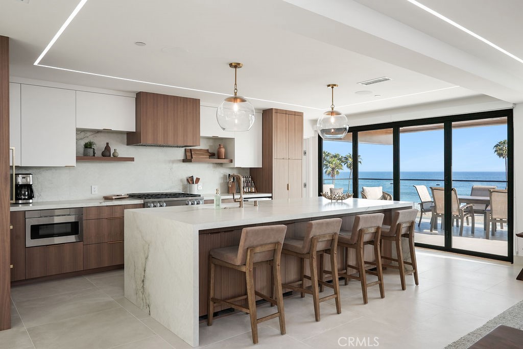 Welcome to your ultimate beachfront escape in the heart of Corona del Mar. Perfectly situated on the prestigious Ocean Boulevard, this fully furnished 4 bedroom, 4.5 bathroom residence offers the rare blend of luxury, privacy, and convenience—just steps from the sand. Enjoy panoramic ocean views from multiple vantage points, including two expansive decks ideal for relaxing, entertaining, or simply soaking up the coastal breeze. Inside, the home features an open-concept living space and spacious bedrooms with ocean views. Whether you're looking for a monthly or extended stay, flexible terms can accommodate your lifestyle. Don’t miss the opportunity to experience true beach living in one of Southern California’s most coveted coastal neighborhoods.