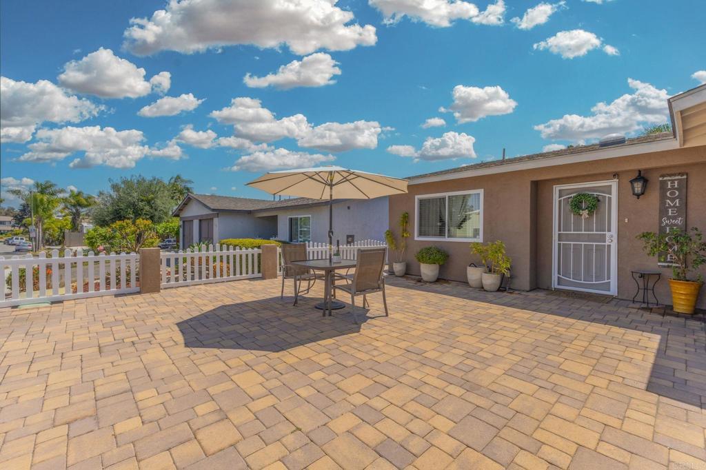 Beautifully remodeled 2 Bedroom 2 Bath home, 1,334 sq. ft., Ample and wide front door entry with 2 coat closets for extra storage. Tastefully and freshly painted throughout, beautiful crown molding in the living room and dining area, wood laminate flooring throughout, upgraded kitchen cabinets with granite countertops, remodeled bathrooms with newer vanities. Primary bedroom has a walk-in closet and sliding door with access to the backyard. Enjoy not 1 but 2 beautiful patios with brick pavers. Both patios are fully fenced with white vinyl fences and perfect for entertaining. No HOA, close to shops & main transportation. Carlsbad School District!