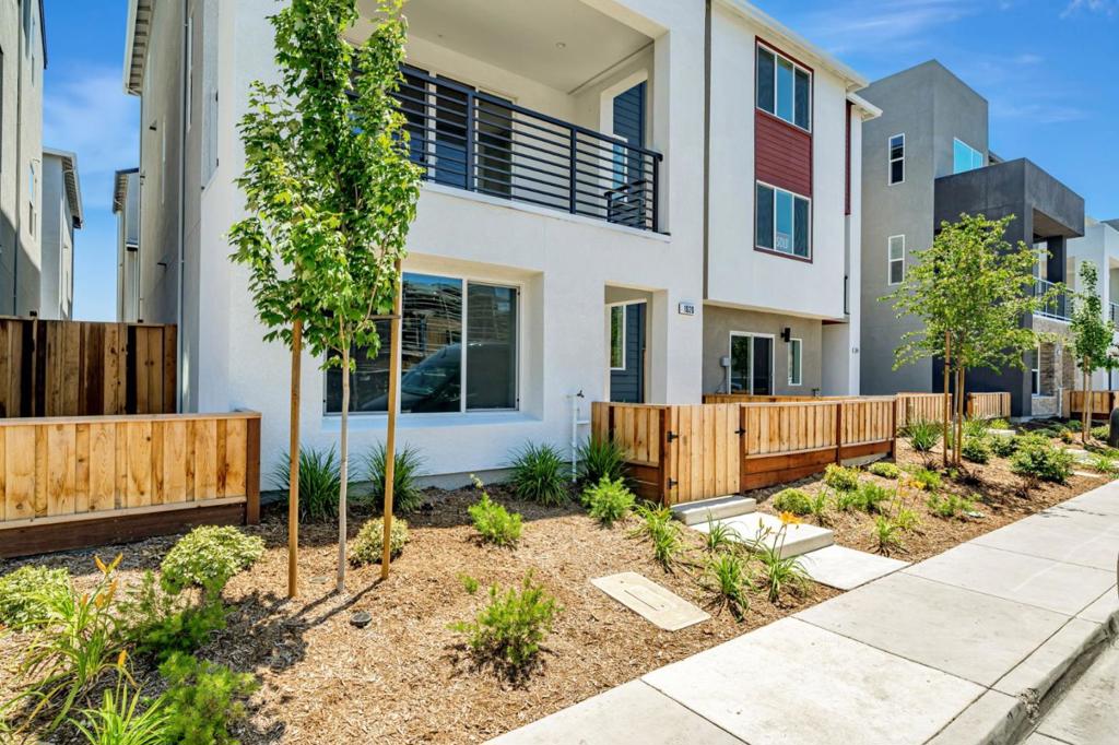 Plan 3 Rows offers 4 bedrooms and 3.5 bathrooms with a side-by-side garage and a beautifully landscaped courtyard entrance. The open layout features a spacious kitchen with a large island, an inviting dining area, and a first-floor bedroom ideal for guests or a home office. Enjoy a generous outdoor deck, perfect for relaxing or dining al fresco. The home includes stylish paint-grade shaker cabinetry and 4" recessed lighting throughout. Solar panels can be leased or purchased, and the home is move-in ready. City Village, by respected builder SummerHill Homes, presents 404 thoughtfully designed new homes in the heart of San Ramon. This active community includes a 2-acre public park, scenic biking and walking paths, peaceful sitting areas, and a shared BBQ area. Conveniently located near the City Walk district and less than a mile from the vibrant City Center with top shopping, dining, and entertainment. Close to Iron Horse Trail, Bridges Golf Club, transit, schools, and major employers. Photos may include renderings or options that vary by home.