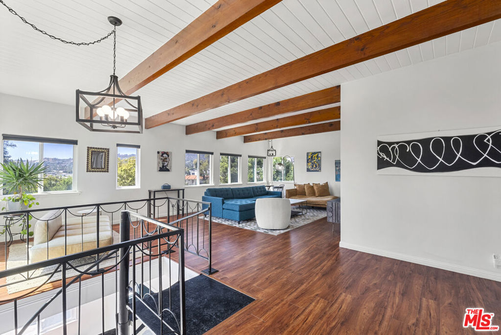 Incredible Value for this Bold design Los Feliz Home with Pool and Incredible Views under $1k per foot! Cinematic views. A rare Los Feliz hills mid-century retreat iconic 1963 Steven Hill architectural with soaring lines, city-to-horizon vistas, and luminous living spaces built for modern life. Enter through a dramatic multi-level layout with an entertainer's bar, lounge, and flex office on the entry floor. Upstairs, an open-concept living/dining area flows to a view balcony and bright kitchen, all basking in light. The primary suite opens to a private backyard oasis with a sparkling pool, framed by mature trees and sky. Two guest bedrooms and a full bath complete the wing. New roof, fresh paint inside and out, and thoughtful upgrades throughout. Moments to Hyperion, Hillhurst, and Griffith Park, this home is a rare mix of architectural pedigree and everyday soul. A true Los Feliz originalfor those who want more than just a house.
