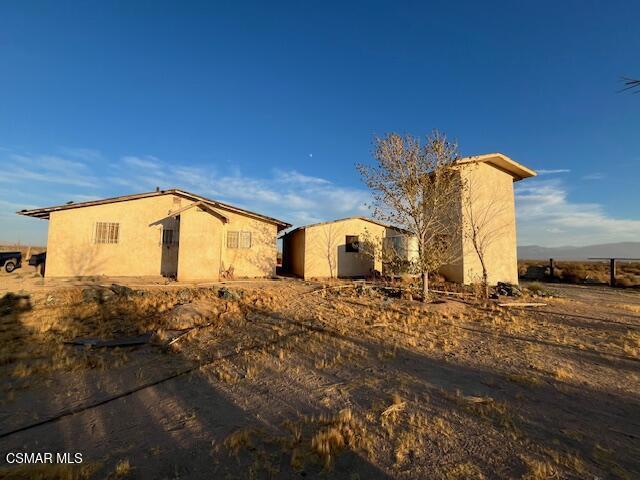 VIEWS of the majestic mountains and open desert, you found your paradise in the High Desert. 2 Bedrooms, 1 Bath, with detached garage. Cozy living room, kitchen with area for dining. A hallway leads to the two private bedrooms which are western facing for those fantastic sunset views. Tiled floors throughout. Plenty of yard space waiting for your personal touch. Approximately 2.3 acres per the county assessor's public tax records. Some recreation areas not far away include Big Bear Lake, Joshua Tree National Park, and Mojave National Preserve. Shopping is located in Apple Valley, and Victorville to name a few. For those looking for wide open spaces away from the crowded cities and neighborhoods this may be it!!!