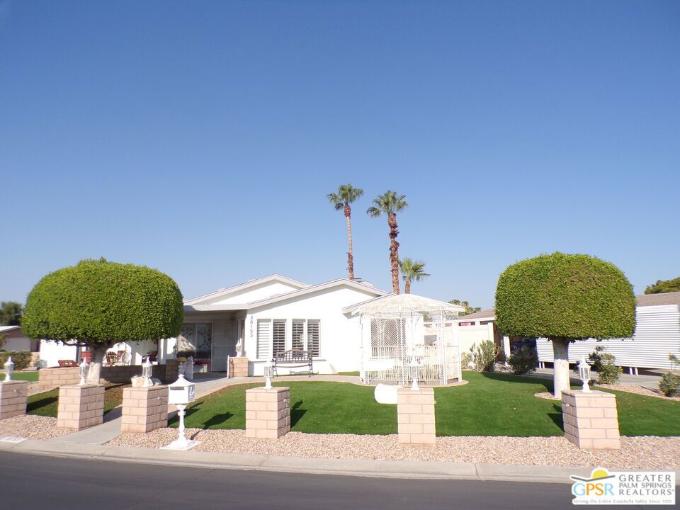 Spacious 3 Bedroom Home in Palm Desert Greens Country Club Where You Own the Land! Welcome to this well-maintained 1,940 sq ft manufactured home in the highly sought-after Palm Desert Greens Country Club, a gated 55+ gated community offering resort-style amenities and low HOA dues. Built in 1994 and situated on a generous 5,227 sq ft lot, this home features 3 spacious bedrooms, 2 full bathrooms. The large primary suite includes an oversized bathroom with ample space for relaxation and comfort. The kitchen is fully equipped with a refrigerator, electric cooktop, microwave, and dishwasher, offering plenty of cabinetry and counter space for all your cooking needs. A new awning adds a touch of modern curb appeal and comfort to your outdoor living space. What sets this home apart? A rare attached two-car garage, providing extra storage and convenience something not commonly found in the community. Best of all, you own the land, making this an exceptional investment in a premier golf community. Don't miss your chance to enjoy the Palm Desert lifestyle golf, pools, social clubs, and more all within a secure and vibrant neighborhood. HOA fees are very low, currently $400 per month, which includes FREE Golf, Cable w/HBO, internet and WIFI, a guarded gate house and mobile security. The community is about 10-miles from the Palm Springs Regional Airport. This community has a 24-hour patrol, and access is only through guarded gates. Eisenhower Hospital, the nearest facility with emergency care, is two miles from the site. There is a restaurant within the community. Professional Photos To Be Uploaded Soon.