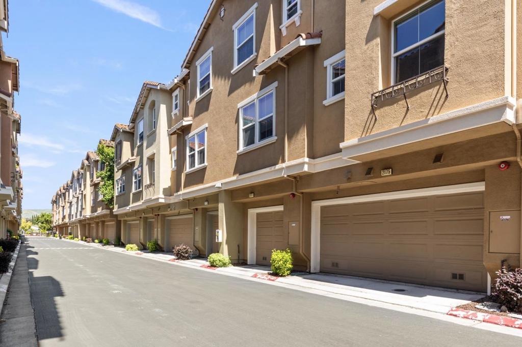 Welcome to this beautiful east-facing townhouse located in the quiet neighborhood of North San Jose. LOW HOA FEE this well-maintained home offers a versatile floor plan that includes a separate living room and an indoor laundry room with extra storage space on the ground floor.The second floor boasts a spacious family/dining room combo that opens up to a well-appointed kitchen featuring stunning granite countertops and a breakfast bar, along with stainless steel appliances. Additionally, there is a bedroom and a full bathroom on this floor, perfect for accommodating guests or in-law quarters.On the top floor, you'll find a generously sized master suite with a walk-in closet, as well as a Junior suite. The townhouse also includes central AC, dual pane windows, and an attached side by side garage and Tesla Charger. It's walking distance to the VTA station, Bart station, and the highly-rated Northwood Elementary School (8/10). It is also in close proximity to popular shopping destinations such as Costco, Great Mall, Ranch 99, and HMart.easy access to highways 880, 680, and 237,this location offers a short commute to future Amazon, Google, Microsoft Office, Nvidia, Cisco, Paypal, and super micro offices. Don't miss out on the opportunity to make this townhouse your new home!