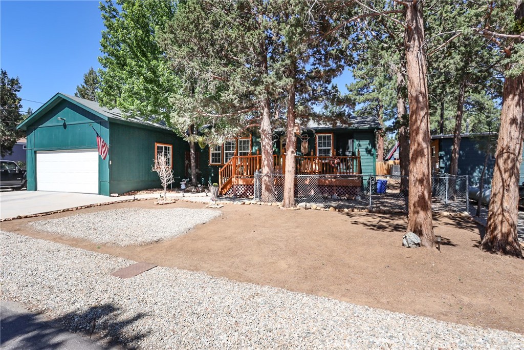 Enjoy mountain living with comfort and convenience in this well-maintained 2005 manufactured home on a permanent foundation, complete with HCD433A certification. Featuring whole-house air conditioning, this home offers year-round comfort. The spacious primary suite includes an en-suite new bathroom and direct access to the front deck—great for enjoying morning coffee. A stunning new 720 sq ft Trex deck in the back expands your outdoor living space, while a 120 sq ft Tuff Shed with electricity offers extra storage or workspace. Fresh exterior paint adds curb appeal, and the fully fenced backyard provides privacy and room to roam. Located close to Sugarloaf businesses, this home offers easy access to local amenities including Big Bear Lake's Village and lots of shopping. Sugarloaf is on the eastern side of Big Bear City and very close to highway 38 up from Redlands. Shown by appointment only—no yard sign—please call to schedule your showing. Furnishings included per inventory list.
