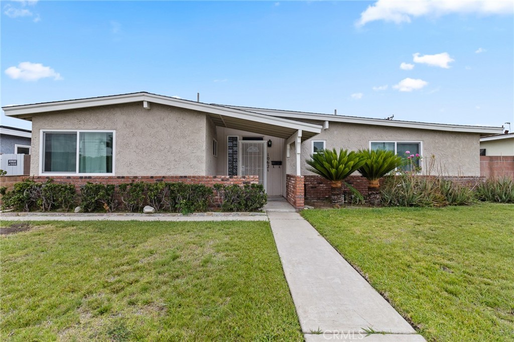 Beautiful 3 bedroom and 2 bathroom home in the city of Anaheim! Walk into your home and you will notice the open floor plan with a spacious living room with flooring throughout the home and tile flooring in the kitchen. All 3 bedrooms are spacious and both bathrooms are located in the hallway near the bedrooms. Walk outside to your large and private backyard that is perfect for entertaining along with a large driveway to park a few cars. The laundry room is located in the attached garage along with the garage being converted to an office which is perfect for anyone working from home. There is also street parking. You are minutes away from retail, supermarkets, shopping, Disneyland and the 5, 91 and 57 freeways.