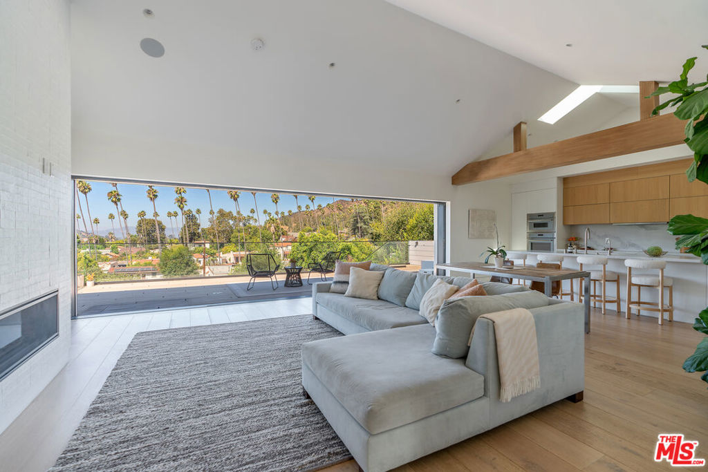 Located north of Colorado Blvd on one of Eagle Rock's most beautiful streets, this redesigned home balances indoor-outdoor living with thoughtful, modern upgrades. The main entertaining spaces are anchored by a floor-to-ceiling slider that opens completely to a spacious deck and sweeping hillside views. The kitchen pairs a generous island with abundant cabinetry and premium appliances. The serene, sunlit primary suite offers a true retreat with dual sinks and a walk-in closet. Two additional bedrooms share a stylishly updated bath and connect via a center hall with concealed laundry and extra storage. Throughout, elevated finishes make daily living as functional as it is beautiful. The two-car garage has been transformed into a full wellness studio with weight rack, cardio, cold plunge, and infrared sauna included. Out back, a sparkling pool and spa set the stage for effortless entertaining and easy evenings under the stars. A standalone ADU at the rear of the lot can be included for an additional fee. All of this is just moments from beloved local dining, coffee shops and neighborhood favorites, with seamless access to the best of NELA. Available furnished or unfurnished.