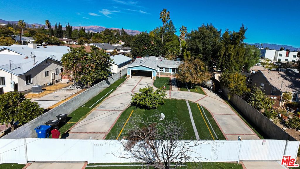 HUGE 20,895 sq. ft. FLAT, RECTANGULAR LOT, Reseda Ranch adjacent! Newly updated. The home is gated, large and cozy, with 3024 sq. ft of living spaces with 5 bedrooms, 2 baths, living room with a fireplace, den and a large bonus room. Circular driveway with parking for several cars and a huge ranch like back yard. Perfect to move right in and enjoy!!! Can you imagine being able to have horses right here in Reseda?