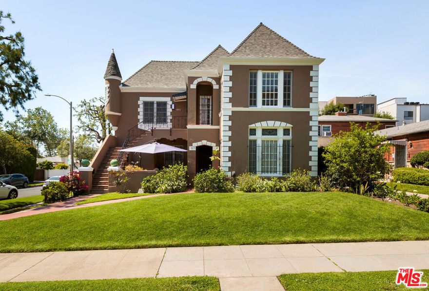 Discover the perfect blend of space, style, and convenience in this charming UPPER 3-Bedroom, 2-Bathroom duplex just moments from the vibrant energy of Westwood and UCLA! Step into Aprox. 2,000 square feet of thoughtfully designed living, where elegant crown molding gracefully frames the expansive living room, cozy den/office, formal dining area, and wide hallways that flow effortlessly into your generously sized bedrooms. Two of the bedrooms boast private en suite bathrooms and spacious walk-in closets, while the third offers flexibility as an extra bedroom, home office, or creative retreat. Entertain with ease in the sunlit living room, complete with a decorative fireplace as your focal point, flowing seamlessly into the adjacent dining room or den. Unwind outdoors on your private covered balcony, the ideal spot for morning coffee or evening relaxation or stretch out in the lush grassy backyard, a rare green oasis in the city. Convenience meets comfort with one dedicated garage parking space included. This is more than a home it's your Westwood sanctuary, ready to welcome you.