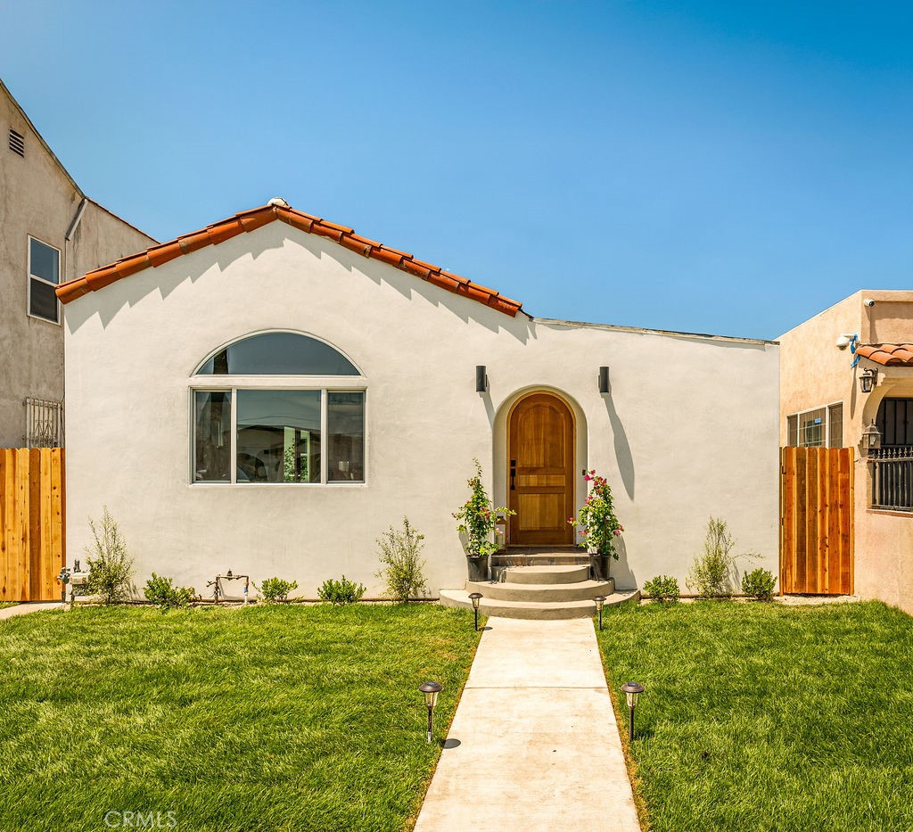 Spanish Gem — Where Modern Comfort Meets Historic Charm -
Step into this beautifully remodeled 3-bedroom, 2-bathroom Spanish-style home, where timeless architecture meets thoughtful, modern upgrades. Located just blocks from the vibrant energy of West Adams, this residence has been reimagined for today’s lifestyle while honoring its classic character.
The home’s exterior features a smooth stucco finish that elevates its iconic Spanish-style design. Paired with a striking arched wood front door and traditional clay tile roof, which offers a warm, polished presence that’s both historic and fresh.
Inside, an open-concept living space welcomes you with natural light, wide-plank wood flooring, and a calming contemporary palette. The fully updated kitchen is the heart of the home—featuring new cabinetry, quartz countertops, a spacious island, and new stainless steel appliances—ideal for daily living and entertaining alike.
Both bathrooms have been tastefully redesigned with designer tile, premium fixtures, and new vanities, creating a spa-like experience. The primary suite is a true retreat, offering a large walk-in closet, abundant natural light, and a deep soaking tub perfect for relaxing after a long day.
This home offers peace of mind with extensive system upgrades, including a new electrical panel, central A/C, updated plumbing, full insulation for year-round comfort, a new roof, and even a built-in fire sprinkler system for added safety.
Enjoy the newly landscaped yard with an efficient irrigation system—or the cozy backyard perfect for entertaining or quiet relaxation. The home is conveniently located near two major Metro lines, with easy access to DTLA, LAX, USC, Koreatown, and Culver City. Close to Kenneth Hahn State Recreation Area – great for hiking, picnicking, or taking in panoramic views of the city. A short drive to Baldwin Hills Scenic Overlook or Exposition Park, home to museums like the California Science Center and Natural History Museum. The community offers historic charm, central convenience, growing walkability all wrapped up in an increasingly popular pocket of LA.
Come make this your Home! Fully Renovated Spanish Beauty — with Potential $20,000 Grant Opportunity!