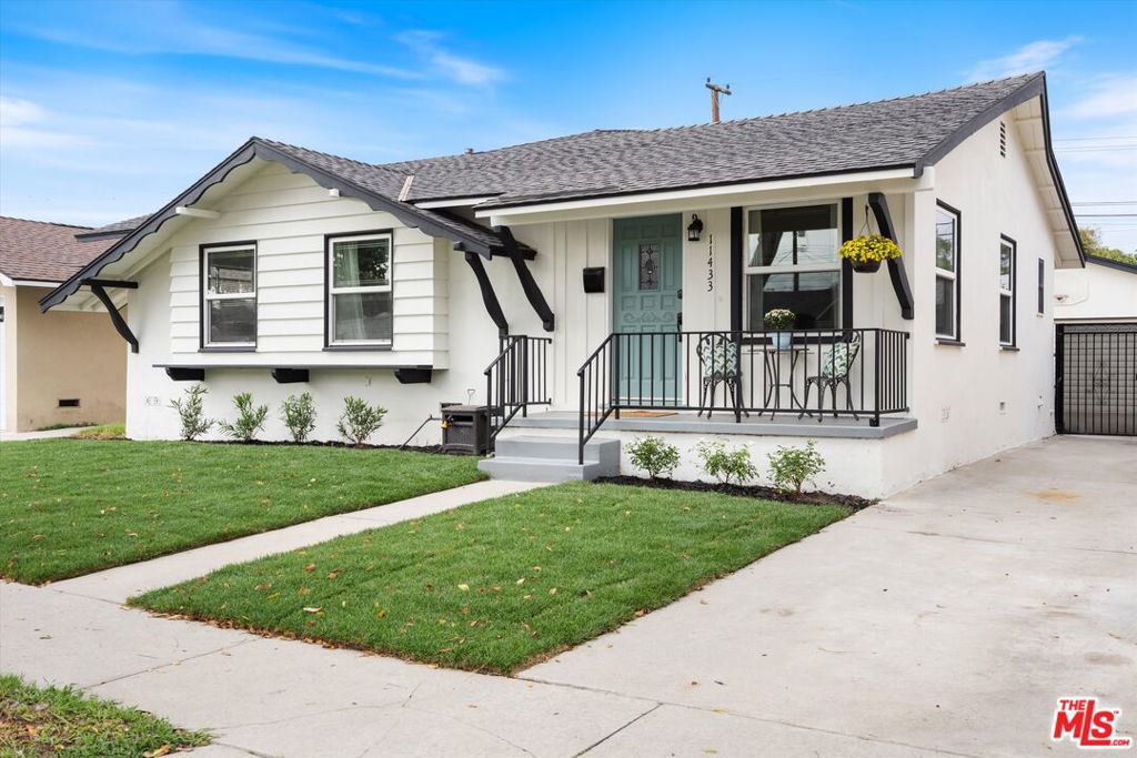 Welcome to 11433 214th St, Lakewood! This freshly painted Mid-Century Ranch-style home with cottage influences offers 3 bedrooms, 2 bathrooms, and a blend of timeless character and modern comfort. The inviting front porch and unique etched-glass dual-pane windows set the tone for a home filled with charm and thoughtful details. Inside, discover an open-concept addition with a large grand room featuring an updated kitchen, dining area, and spacious family room anchored by a cozy gas stone fireplace. The seamless layout is perfect for entertaining or relaxing at home. The primary suite is a true retreat, complete with its own gas fireplace and a spa-like bathroom boasting a 2-person jetted tub and dual vanity. Additional highlights include a separate laundry room, detached 2-car garage, and a generously sized backyard ideal for outdoor gatherings, gardening, or play. This neighborhood is a rare gem for anyone who values outdoor living and convenience. Just a short stroll away, you'll find Rynerson Park and Home Run Dog Park 40 acres of open space with bike and walking trails, picnic spots, and baseball diamonds. Mae Boyar Park is also nearby, offering playgrounds, basketball courts, and plenty of room to relax or play. You're also close to the Lakewood Center, the West San Gabriel River Nature Trail, and the San Gabriel River Bike Path plus only about a 10-minute drive to the beach.Situated on a quiet street in a prime location near schools, parks, shopping, and dining, this Lakewood gem combines style, comfort, and convenience in one incredible package.