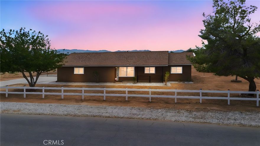 Welcome to 20631 Zuni Road in Apple Valley, a completely renovated three bedroom, two bathroom home sitting on a full acre of land. Every detail has been thoughtfully redone, making this property truly turnkey for its next owner. Inside, the open layout feels light and inviting with new dual pane windows, fresh paint, recessed lighting, and brand new vinyl plank flooring throughout. The kitchen has been completely rebuilt with quartz countertops with a waterfall end cap, a large single basin sink including workstation, custom herringbone tile backsplash, new shaker cabinets, and stainless steel appliances. Both bathrooms have been remodeled with new tubs, showers, vanities, quartz tiling, and matte black fixtures that bring a modern touch.



This home is not just about the interior. Outside, you’ll find a brand new exterior paint job, drought tolerant landscaping in the front yard, and a white picket fence accented with solar powered post lights that give the property a charming curb appeal. On top of that, there is a large 15 by 20 shed that provides extra storage or space for projects. With a lot size of 43,560 square feet, there’s plenty of room for RV parking, outdoor toys, animals, or even future expansion.



Located in the desirable High Desert community of Apple Valley, this property combines modern living with wide open space and stunning views. It’s move-in ready and set up to be enjoyed from day one. This is the perfect opportunity for a buyer looking for a fresh, stylish home with land and flexibility to grow.