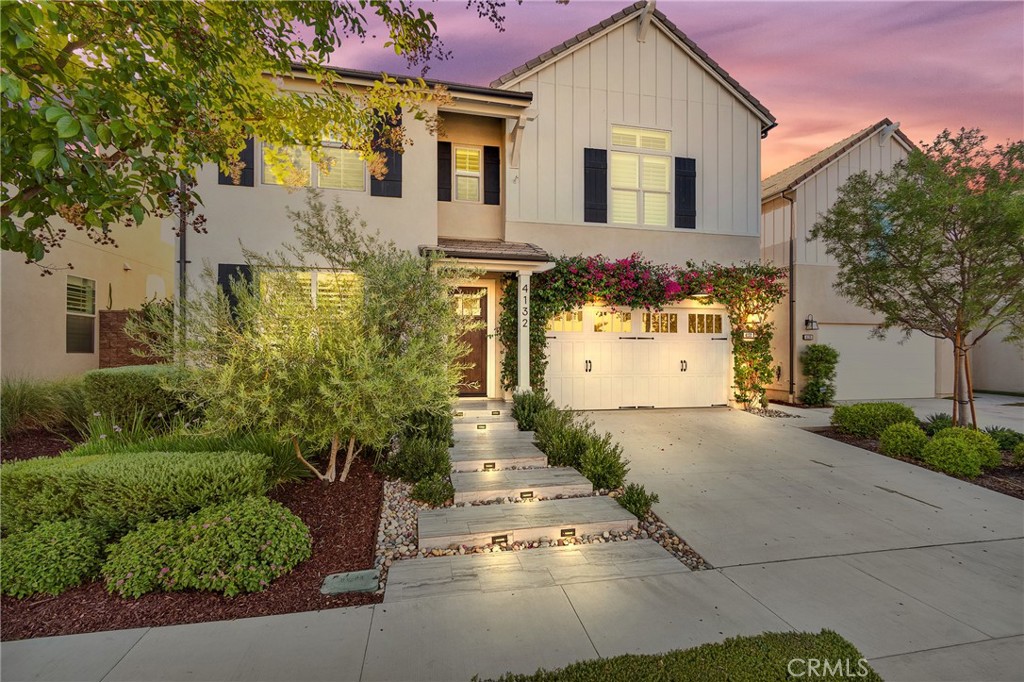 $200,000+ UPGRADES / GATED COMMUNITY / 4 BEDROOMS + LOFT / DOWNSTAIRS BEDROOM & BATH / 3-CAR GARAGE
Welcome to refined living in the highly sought-after gated community of Bedford in South Corona. This exceptional home boasts over $200,000 in high-end upgrades and custom details, making it a true showcase of craftsmanship and thoughtful design.
Step inside and immediately notice the extensive millwork throughout, including custom shiplap accents, detailed trim, a wood-trimmed stair well skirt, and custom crafted square-nose stair treads paired with sleek melamine risers. The family room features a one-of-a-kind fireplace with shiplap surround and rustic wood mantle, creating a warm and inviting focal point.
The gourmet kitchen offers abundant storage with added cabinetry that extends to the ceiling, a custom wood shaker hood, and a spacious walk-in pantry enhanced by an upgraded glass door. Storage and space is a recurring theme in this home, with smartly designed solutions throughout: a large primary suite walk-in closet with custom built-ins, soaring 12’ ceilings in the secondary bedroom also with a custom closet system, and an oversized 3-car tandem garage equipped with wall organizers, overhead storage, and a dedicated ChargePoint EV charger offering fast charging with 12 kW (240V, 50A) power.
The downstairs bedroom includes a Murphy bed, providing flexible use as a guest space or office. Every detail has been thoughtfully chosen, from luxury vinyl plank flooring and new carpet in the bedrooms to plantation shutters and Everlights permanent holiday lighting professionally installed and controlled by an app.
Outside, professionally designed low-maintenance landscaping and hardscaping complete with commercial grade low voltage lighting complement the home’s elevated interior finishes.
Living in Bedford also includes access to resort-style amenities: multiple pools, a fitness studio, clubhouse, dog park and spa, playgrounds, and scenic walking trails. Once you visit, you won't want to miss making this memorable home the next chapter in your storybook.