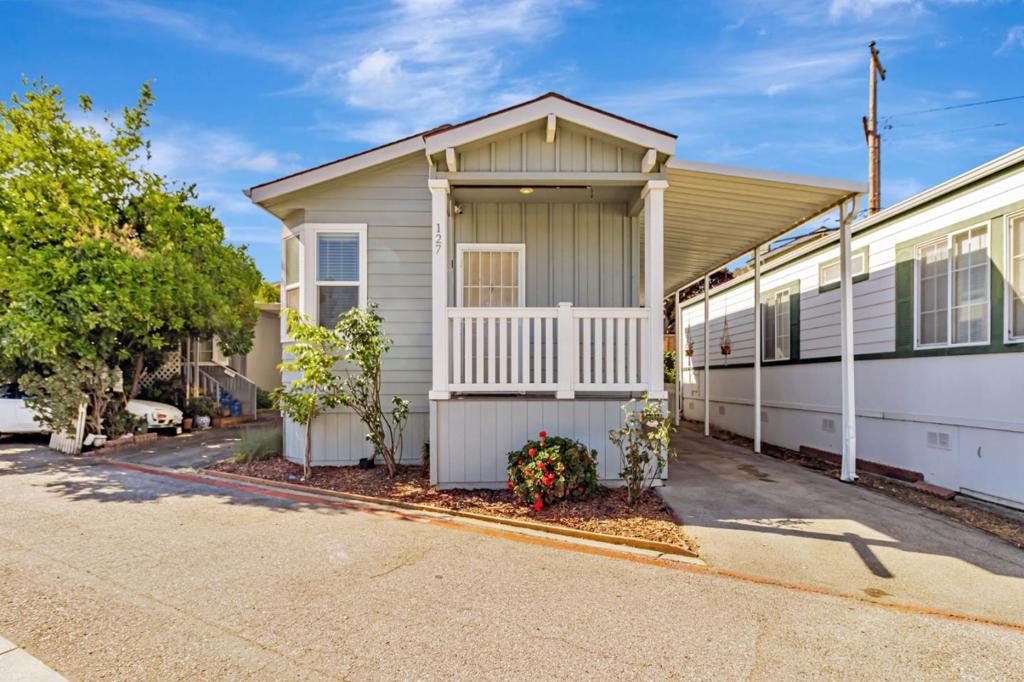 Welcome to this delightful 958 sq ft home located in the vibrant city of Mountain View. This residence offers three bedrooms and two bathrooms, featuring double sinks for added convenience in the primary bathroom. The kitchen is well-equipped with modern appliances, including a dishwasher, microwave, oven range - gas, refrigerator, and a handy island, making it a perfect space for culinary enthusiasts. The flooring consists of a combination of carpet and laminate, providing comfort and style throughout the home. The property includes a ground floor bedroom and comes with cooling options via ceiling fans. The dining area is integrated into the family room, enhancing the open floor plan, central forced air heating. For added convenience, there's an in-unit washer and dryer for laundry needs. This home is situated within the Mountain View Whisman Elementary School District. Don't miss your chance to live in this charming Mountain View abode!