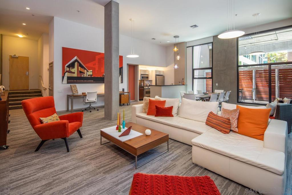 Incredibly unique opportunity in one of East Village's best buildings...Icon! This 1st floor condo is a live/work space w/spectacular 14' ceilings & walls of glass that bring in lots of natural light. It has 1 bed/1 bath & a huge living area to entertain. The living area flows onto a patio with privacy fencing. Use it as a personal residence or as a private office space for an attorney, architect, insurance agency or any other business that has limited visitors. Great location in the building next to the gym and community room. Awesome East Village location across the street from Petco Park & near lots of great dining options. In-unit laundry & 1 parking space are included. Equipment: Dryer,Fire Sprinklers, Washer Sewer: Sewer Connected Topography: LL