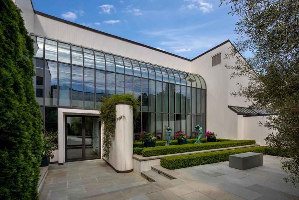 This incomparable property is a tour de force of contemporary styling w/many rooms enjoying signature solarium glass walls & glorious views. A recent & extensive renovation inside & out transformed the home into a remarkably chic & sophisticated estate of more than 8,500 SF total on just over 3 acres. There is a tremendous sense of volume throughout created by towering ceilings, entire walls of glass,& subtle level variations between rooms. Every inch has been beautifully rendered w/the highest quality & craftsmanship plus behind-the-scenes amenities have been added or upgraded for security, automation, solar power, backup generator, and fire suppression. The grounds are equally transformed into stunning venues for outdoor living w/pool, spa, bocce court, and barbecue kitchen. Located on Woodsides premier corridor, this extraordinary property is just two miles to the center of town, close to Sand Hill Road venture capital centers and Stanford University, and two international airports.
