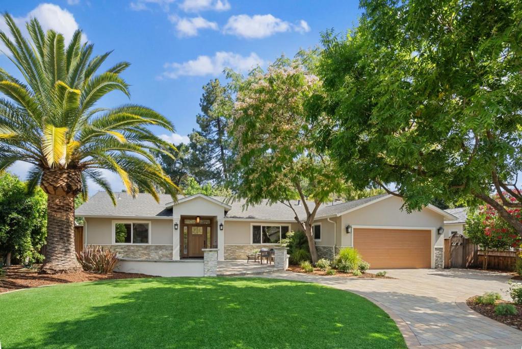 Set on a private cul-de-sac, this elegant, modern home rests on over a quarter acre and blends timeless sophistication with fresh design. Great curb appeal begins with a paver driveway, stacked stone accents, and landscaped grounds, while 3,000+ square feet of refined space showcases richly hued engineered wood floors, skylights, and elegant wall coverings. Bright living areas include a formal living room with fireplace, a media room with ceiling-mounted projector and screen, a chefs kitchen with statement Bertazzoni range, and a walk-out family room. Four bedrooms include a guest suite and a luxurious primary suite with its own fireplace. A dedicated office, AC, and 2-car garage add functionality. The inviting backyard offers a patio, hot tub, and newly planted lawn. All in a prime location near parks, Rancho Shopping Center, and Highway 85, with top-rated schools Oak Avenue Elementary, Blach Junior High, and Mountain View High less than a mile away.
