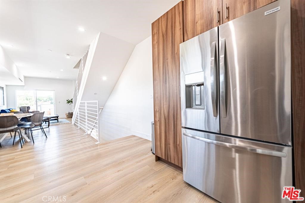 Modern 4-Bedroom Townhouse in the Heart of NOHO Arts District. Welcome to this beautifully crafted 4-bedroom, 3.5-bathroom townhouse in the vibrant North Hollywood Arts District. Offering 1750 square feet of contemporary living space, this newer construction home combines style, functionality, and an unbeatable location. Flooded with natural light, the open-concept layout showcases clean neutral tones, elegant finishes, and thoughtful design. The chef-inspired kitchen features a large center island, stainless steel appliances, and imported cabinetry—perfect for everyday living or entertaining guests. Recessed lighting and an innovative, Google-controlled central HVAC system complement the spacious living areas to ensure year-round comfort. Each generously sized bedroom provides ample storage and privacy, ideal for families and roommates. Enjoy seamless indoor-outdoor living with two balconies and a large private backyard—perfect for relaxing, dining al fresco, or hosting get-togethers. Additional highlights include in-unit laundry. Located just steps from NoHo West, popular restaurants, grocery stores, and exciting new developments, this home puts you at the center. Experience the energy, creativity, and culture that define North Hollywood. Don't miss this opportunity to own a modern townhome in one of LA's most dynamic neighborhoods. Schedule your private showing today!