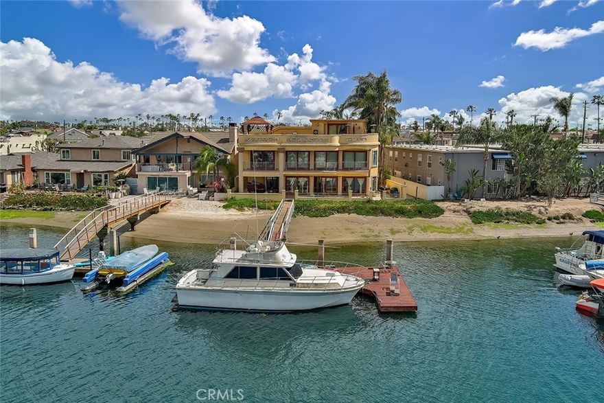 Welcome to waterfront living at its finest on prestigious Naples Island!

Situated on the largest open-water lot in the area, this stunning home offers an unparalleled 92 feet of water frontage—more than any other property on the island. Enjoy breathtaking views, direct canal access, and the ultimate Southern California lifestyle from your private dock.

Designed for indoor-outdoor living, the home features a spacious, light-filled floor plan with walls of glass framing the sparkling water. The main living areas flow seamlessly to an expansive patio perfect for entertaining, while upstairs, a spectacular rooftop deck crowns the property—offering panoramic views of the canal, sunsets, and the surrounding beauty of Naples Island.

Generously sized bedrooms, multiple living spaces, and timeless architectural details complete the residence, while the unbeatable location places you just moments from vibrant shops, dining, and recreation.

This is more than a home—it’s a rare opportunity to own one of Naples Island’s most iconic waterfront properties.