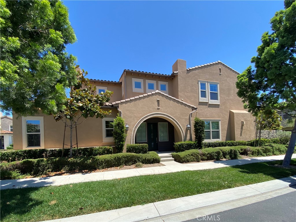 Don't miss this rare opportunity to own a beautiful former model home in 24-hour guard gated resort community of Altair. This model home is a detached single family house and the land use is condo. It has luxury upgrades throughout and is close to brand new condition. This must-see house is an ideal one that everyone loves. It comes with smart home features electric roller shields. First floor includes a convenient bedroom and a full bathroom. Second floor loft has a build-in wet bar comes with 2 wine coolers and that area can be converted to a 2nd family room, office or media zone with ceiling speaks installed. Outdoor retreats with covered California room with fireplace. Backyard has water feature design with three fountains and a sitting area with a unique design ground fire pit. Property is walking distance to clubhouse and is located just across street from top rated Portola high school.