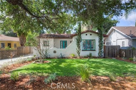 RENTERS DREAM! Old World charm meets modern luxury living in this turn-key Spanish Single Family Residence, WITH a SEPARATE LARGE UNIT/ADU, which you can either rent-out and make money sub-rentng . . . OR use as an art or music studio/office! Welcome to 98 and 100 Tremont Street, your Pasadena paradise. An effortlessly paved driveway gives way to Saltillo tiles as your window to this remarkable residence. The impressive wood and wrought iron front door guides you through the first of the dual dwellings. Upon entrance is a visual sensation straight from a page of leisurely literature. Gather around the brick fireplace, remark at the high ceilings, or cater to a crowd in your charming kitchen, complete with stainless steel appliances, custom cabinetry, and courtyard views. Once outside, you can catch yourself perched under the pergola, or using your green thumb amongst the many fruit and olive trees. Just within eyesight is the second residence, a 515 square foot guest-home boasting its own gas/electric meters, grandiose kitchen, and bathroom. Whisk yourself away to this suburban villa, which is conveniently located near major freeways for commuting, The Rose Bowl for sports fans, cute cafes for coffee, and multiple trailheads for the adventurous types.