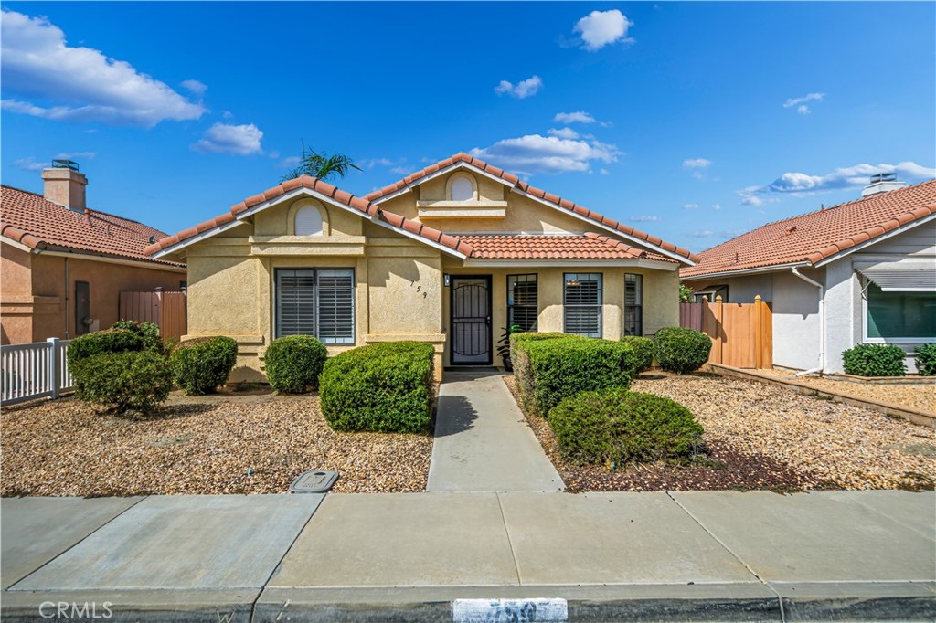 Welcome to 759 Via Linda Drive! Discover comfortable, single-story living in this charming 2-bedroom, 2-bath home located within a 55+ senior community in West Hemet. Built in 1989 and spanning approximately 1,089 sq. ft., this well-maintained ranch-style residence offers an inviting living room complete with a cozy fireplace, an attached two-car garage, and low-maintenance yard care. The interior features include tile floors in walkways, kitchen and open living areas, new plush carpeting in bedrooms, plantation shutters, and efficient forced-air heating with central cooling. Step outside to a covered patio and take in serene mountain views from your front yard, perfect for relaxing mornings or evening sunsets. With an HOA fee of just $60 per year in this quiet tract, you’ll enjoy convenient access to shops, dining, groceries, and entertainment, while being part of a friendly, thoughtfully designed senior community. At a nicely sized lot of roughly 3,400 sq. ft., this property offers the ideal balance of indoor comfort and outdoor ease—an excellent opportunity for those seeking active, low-stress living in Hemet.