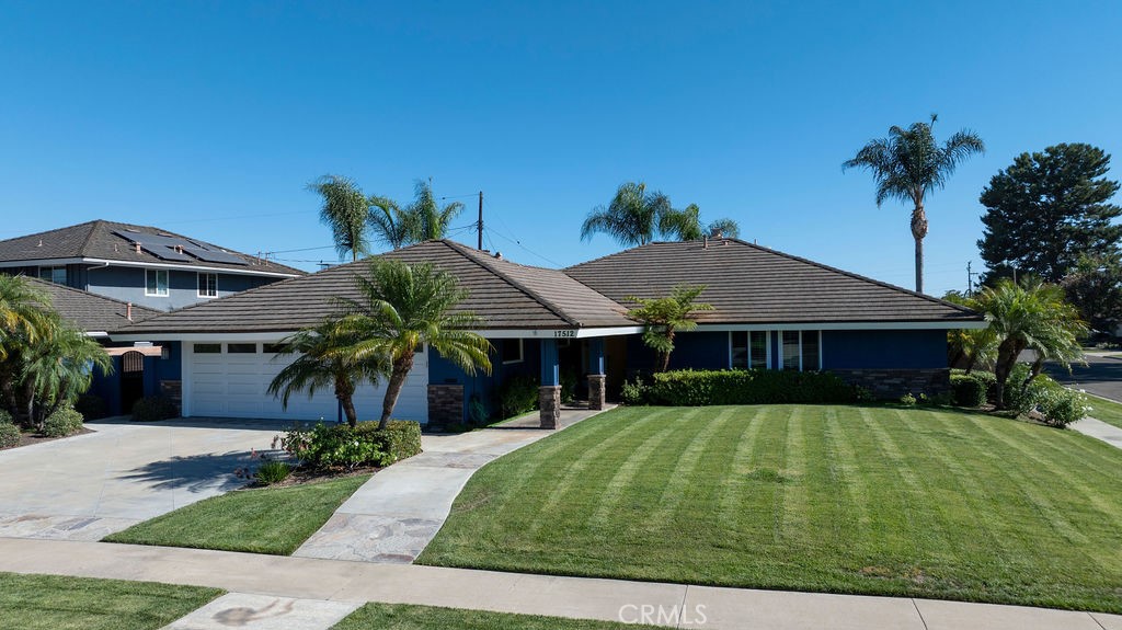 Welcome to your dream home in North Tustin! This beautifully updated single-level residence sits on an expansive 10,370 sq ft corner lot with wide, tree-lined streets and incredible curb appeal. Step inside to discover stunning hardwood floors, sun-filled living spaces, and two cozy fireplaces. The heart of the home is the chef’s kitchen, featuring a 6-burner pro-style range, granite counters, and stainless appliances—perfect for cooking and entertaining. Enjoy the comfort of updated bathrooms, newer HVAC with all-new ductwork, dual-pane windows and sliders, fresh paint, plus a water softener and drinking water system. With 4 spacious bedrooms, 3 baths, and a 3-car garage, this home offers room to live and grow. Zoned for award-winning Tustin Unified schools and just minutes from shopping, dining, freeways, John Wayne Airport, and OC beaches—this is the one you’ve been waiting for!