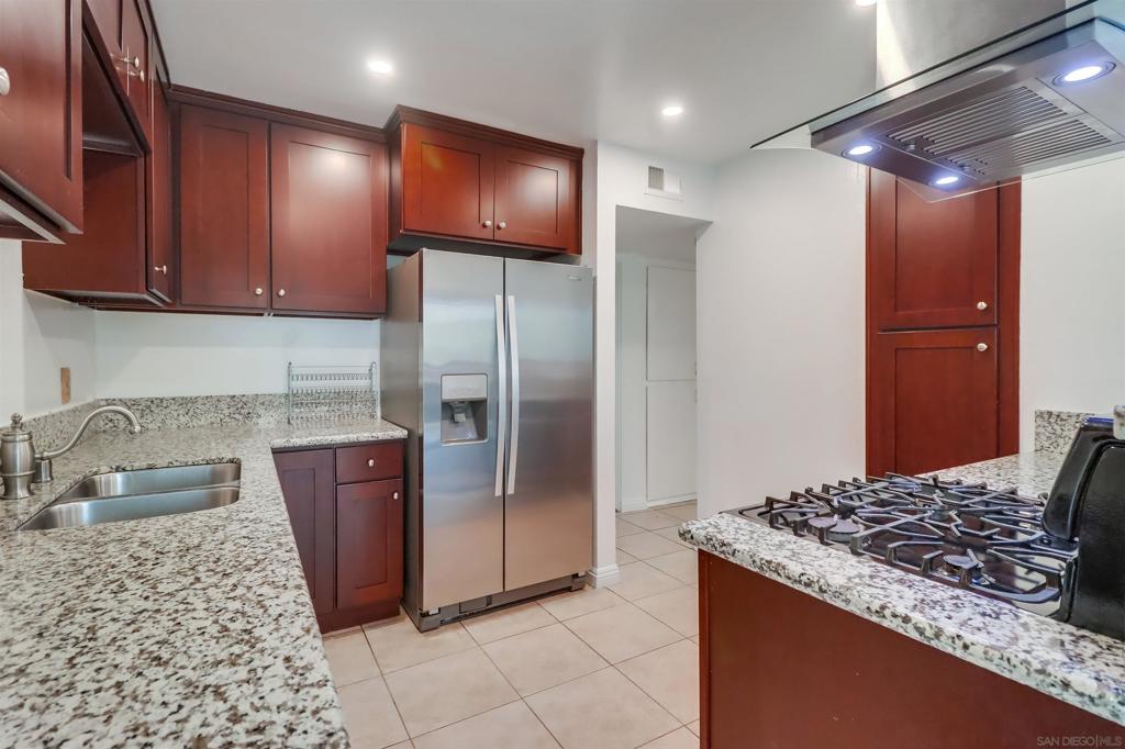 Welcome to 1278 East Madison Avenue, Unit C, a delightful single-story condo located in a gated community in El Cajon, CA. This move-in ready home offers 1,088 square feet of living space, ideal for first-time home buyers. Featuring two spacious bedrooms with ample closet space and two bathrooms, this condo combines comfort with convenience. The newer kitchen is equipped with newer cabinets, and the property was freshly paint, with canned lighting in the living room & kitchen, and double-pane windows throughout. Enjoy central air conditioning and heating, private washer/dryer, and a covered parking space. The large laundry room and community amenities, including a pool and recreation area, add to the appeal. The HOA covers water, trash, sewer, and hot water, simplifying your lifestyle. Don't miss this opportunity to own a charming condo.