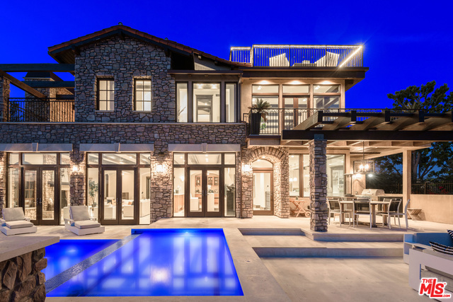 Incomparable new construction that encompasses 360 panoramic views overlooking Beverly Hills and the coveted Beverly Park Community. The 8,535sf of impeccable living space is separated by three levels as well as a fourth rooftop deck and lookout point that deliver some of the best views Beverly Hills has to offer. Grand entrance with dramatic spiral staircase opens up to high ceilings and large family room, state of the art kitchen, dining area and separate living room. Large, open glass windows and doors bring natural light to the home, leading out to the entertainer's patio, infinity pool, jacuzzi, and bbq area. Upstairs includes 3 bedrooms and the incredible master suite complete with a lavish bathroom, envious oversized walk in closet, and outdoor balcony with a fireplace. Downstairs, the basement level has an oversized entertainment center with wine cellar, massage area, steam room, and fifth bedroom adjacent to the 8 car garage perfect for showcasing your auto collection.
