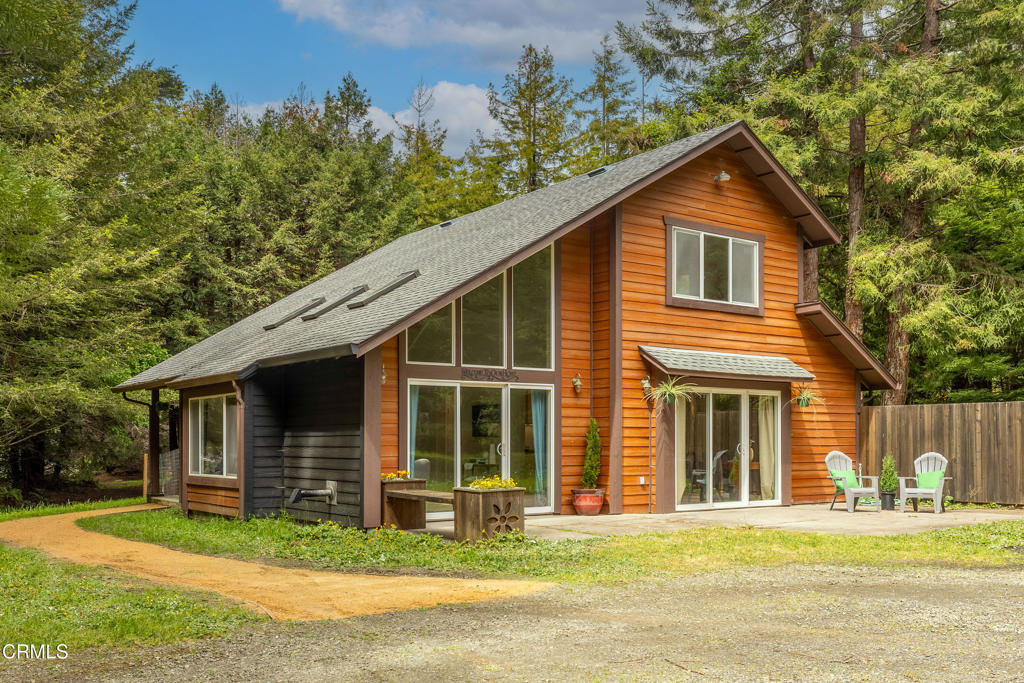 Positioned on the cusp of the coastal sunbelt, this exceptional 2.5-acre live/work property offers the perfect blend of country charm, modern comforts, and endless opportunity. Whether you're raising animals, running a business, or simply looking to live life more fully, this versatile estate is designed to support your lifestyle in every way. The two-story, 3-bedroom, 3-bathroom home, built in 2002, is filled with natural light and thoughtful design for viewing the beauty of the outdoors. Large skylights and bay windows brighten the open-concept living area, which transitions naturally into a welcoming kitchen featuring a large walk-in pantry, making it perfect for the home chef or entertainer. A pellet stove, expansive windows, and sliding doors offer tranquil views of the park-like setting with manicured mature redwoods. Enjoy sunny afternoons on the patio or gather around the fire pit for evening laughter and marshmallows. This home was made for connection and comfort. The spacious primary suite is located on the main floor, offering convenience and privacy, while two well-sized guest bedrooms and bathroom await upstairs. A generous laundry room, a conveniently located guest bathroom on the main level, and 1,500 sq ft of living space make this home as functional as it is inviting. For those seeking space to build or create, the property features a massive 5,000 sq ft metal workshop with two oversized bay doors, a bathroom, and an upper-level mezzanine wired for a future apartment. With a history in woodworking and automotive projects, this structure is ready for nearly any endeavor. Animal lovers will appreciate the newly built barn with water, electricity, and rolling doors, while three RV parking spots with hookups and a second septic system offer added flexibility. An automatic generator ensures peace of mind. Quiet and private, yet just minutes from downtown conveniences, beaches, and local shops, this serene country estate offers the best of both worlds. With welcoming small-town neighbors and all the space you need to truly Live, Work, and Thrive.
