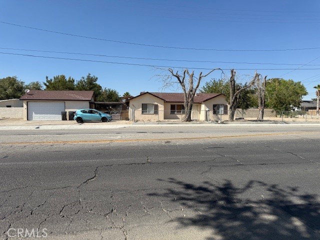Excellent ADU development opportunity! This property is strategically located in the heart of West Lancaster, very close to the 14 Freeway. Its 16,087 sqft corner lot features an expansive frontage area alongside Avenue K8. The city recently completed infrastructure and sidewalk improvements alongisde Avenue K8. Currently on the lot is a 3+2 single family home, rented at $1,974/month to a longtime tenant. There is also a detached garage that is believed to have water/sewage connections capped off and present, and a large metal carport. Lastly, there is a large unused area of the lot to the west of the carport. With this arrangement, this property may be the perfect candidate to leverage California's ADU laws. The ideal scenario would be to keep the existing house as a rental (and either raise the rent or replace the current tenants with higher-paying tenants), build a ground-up or modular ADU on the excess land at the west side of the property, and convert the existing detached garage into a Junior ADU. The detached garage would likely be an easy ADU conversion since the structure is already present. The excess land is perfect for a new construction ADU, as it would sit far away the other 2 units and would have its own driveway off the street. The tenants can utilize the existing carport for shared parking. Upon completion, this property has the potential to become an excellent triplex with 3 detached units, and this can be done without any zoning changes because of the ADU laws. In the meantime, while waiting for city approvals (believed to expedited under the ADU laws) and for the construction to take place, the developer can collect rent from the existing tenants and avoid having ''dead money'' tied up in a vacant lot. In all, it's hard to find a better ADU candidate than this property, with its detached garage and ample land for a new construction ADU. If you've been looking for the ideal property to build ADU's and generate cash flow, you've found it.