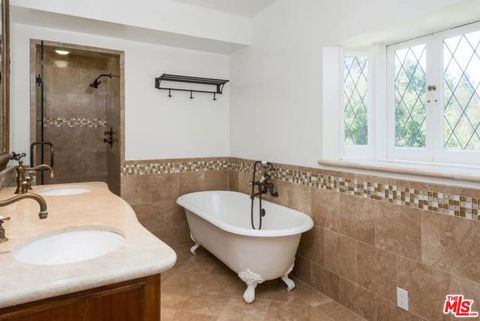 Tiny photo for 1957 MANDEVILLE CANYON Road, Los Angeles, CA 90049 (MLS # 25615483)