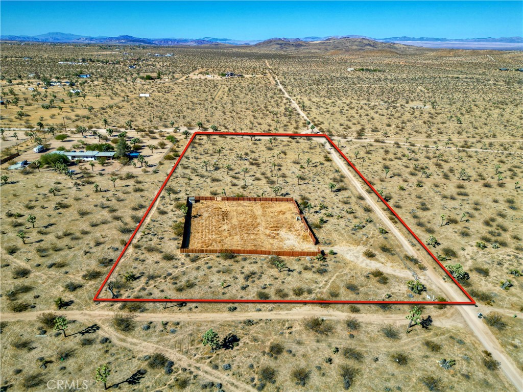 Welcome to your desert sanctuary! Nestled just north of Yucca-Mesa in the North Aberdeen area, this pristine five-acre corner parcel offers a canvas for your dream oasis amidst breathtaking desert and mountain panoramas. Embrace the serenity of desert living while being a short drive away from the renowned Joshua Tree National Park, Pioneer Town, local attractions like Giant Rock, the mystic Integratron, and acclaimed restaurants such as Pappy and Harriets, La Copine, along with many other hidden gems waiting to be discovered. Additionally, it's just a 45-minute drive to the vibrant downtown city of Palm Springs, CA. Discover the endless possibilities this land presents, whether you envision a secluded desert getaway, an artist's retreat, want to build a recreational cabin, a single-family home, or other type of sustainable living space. With a water meter already installed by Hi-Desert Water District and overhead electricity available on Sunny Sands Dr., the groundwork is laid for your vision to take shape seamlessly. There are multiple neighboring single-family homes. Take advantage of the abundant outdoor activities nearby, from hiking and rock climbing to stargazing beneath the clear desert skies. Delight in the tranquility of the desert landscape while still enjoying convenient access to amenities and attractions. This corner parcel offers additional privacy and flexibility in designing your desert retreat. Don't miss this rare opportunity to own a piece of desert paradise and create memories that will last a lifetime. Go tour it today and let your imagination run wild in this unparalleled desert haven.