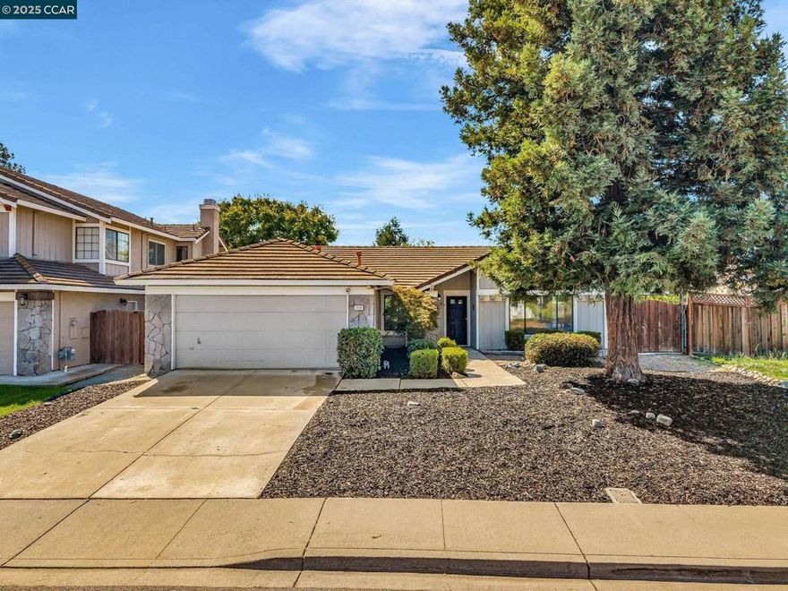 Freshly updated and move-in ready! Welcome to 2404 Whitetail Dr in Antioch—a spacious, light-filled home that was just freshly painted. This home features vaulted ceilings, gleaming floors, A/C and a backyard designed for entertaining. Enjoy the formal dining area, cozy breakfast nook, and a family room anchored by a classic brick fireplace. The kitchen offers a NEW built-in oven, NEW dishwasher and generous cabinet space. Relax under the shaded patio or admire the landscaped front and back yards. The large master suite boasts a walk-in closet and a beautifully renovated bathroom with new tile, shower, and tub. Additional upgrades include a newer furnace, updated light fixtures, new flooring, and full interior paint. Stone accents and a tile roof add curb appeal, while the side yard offers extra flexibility. Located near parks, schools, shopping, and commuter routes. A perfect blend of comfort, style, and convenience—don’t miss it!