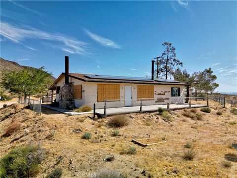Photo of 55190 Pipes Canyon Rd, Yucca Valley, CA 92284 (MLS # JT26093547)