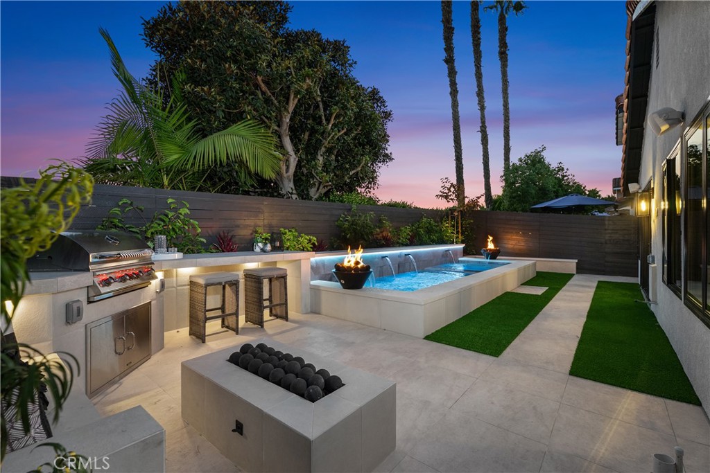 This stunning single-level home has been meticulously renovated to offer modern luxury at every turn. With a brand-new PEX repipe and tankless water heater, plus an upgraded fireplace, it’s clear that no detail has been overlooked. Inside, you'll find luxury vinyl plank floors, smooth coat walls, and recessed lighting throughout, paired with custom Milgard windows and a striking custom Dutch front door. The open-concept kitchen is a chef's paradise, featuring Café GE appliances, custom cabinetry, and top-of-the-line finishes. Additionally 11 custom skylights grace the home for optimal light. Spa-like bathrooms are outfitted with rain showers and premium fixtures, while new exhaust fans enhance ventilation. The entire home is powered by a brand-new Lennox HVAC system, complete with ducts and air vents, plus ceiling fans and custom Lutron shades for added comfort. The garage boasts an epoxy floor, custom lighting, and a side-assembly garage door, while the home’s audio and security systems include Sonos speakers in the house, garage, and backyard, as well as Luma video surveillance and motion detector lights. Outside is your own private oasis with a saltwater plunge pool, spa, fire-water bowls, and upgraded PAL landscape lighting. The backyard is complete with porcelain tile walkways, artificial grass, new hardscape, and professional landscaping. Entertain in style with the built-in Bull BBQ area, and enjoy peace of mind with new electrical upgrades, including a 200 AMP panel and yard drainage system. This is truly the epitome of turnkey living in a beautifully designed, single-level home. Professional photos coming.
