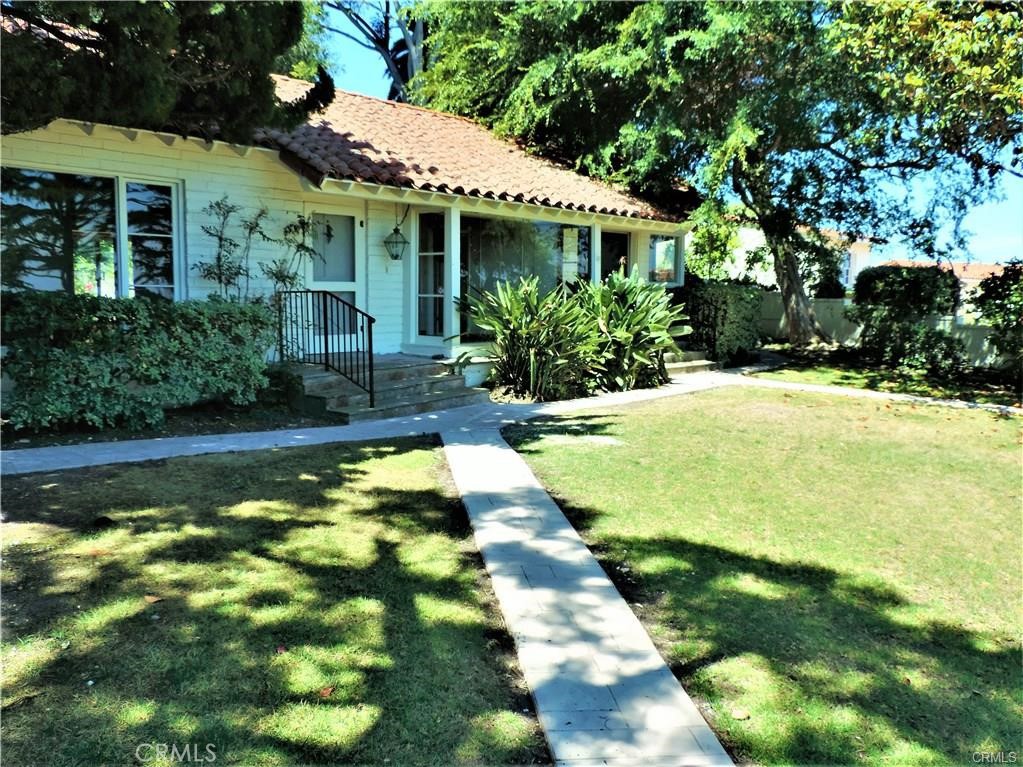Beautiful one level home with expansive city, mountain, and Queen's Necklace Ocean views situated on a large lot at the bottom of a private driveway. Newly upgraded fixtures and lighting, hardwood floors, spacious kitchen, two fireplaces, and wet bar. This home has the feel of a hillside retreat, with lots of space and light throughout, and lush greenery surrounding the exterior Detached two car garage has a large downstairs bonus room that can be used as a gym, office, or guest room. Walking distance to best elementary school. This is a place you will look forward to coming home to.