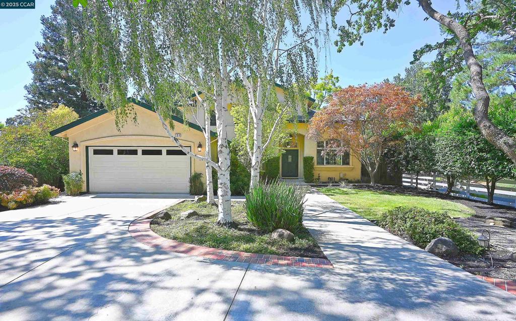 You will fall in love at your first view of this 5-bedroom home with fabulous architectural details and a stunning circle driveway shaded by gorgeous mature trees! Experience the serenity of the home's entry, framed by mature Japanese Maple trees, welcoming you to two-story ceilings and a custom mosaic tile entry... Living and dining rooms offer high ceilings, and the heart of the home kitchen is spacious w/central island, abundant cabinetry and smooth surface counters. The casual dining area enjoys views of the backyard and Zen fountain attracting many birds to its bubbling waters. The family room has a fireplace access to the backyard. Two main-level bedrooms and full bath provide flexible living options. Upstairs, the vaulted ceilings offer volume and light in the primary bedroom showcasing views of the backyard. The suite offers two walk-in closets with organizers, shower, large soaking tub, dual sink vanity, bidet and linen cabinets. Two additional bedrooms upstairs are located adjacent to the hall bath. The park-like back yard offers a patio, lawn, dog run & perimeter area to ride bikes and pets to run! Two-car garage has numerous cabinets. Excellent Walnut Creek & Acalanes schools, close to downtown, Hwy access & Bart. Get ready to fall in love with your new home!